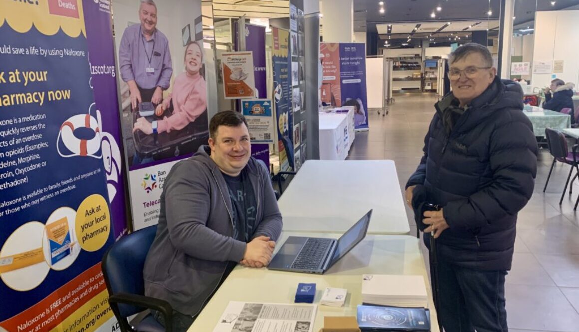Lewis and John at the NETRALT stand in the Vaccination Hub, Bon Accord Centre, Aberdeen